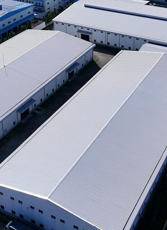 Aerial of white metal warehouse roofs served by commercial roofing St Louis